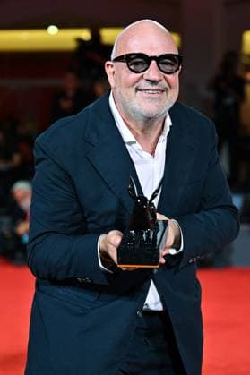 Venice Winners Red Carpet AM Gianfranco Rosi poses with the Special Jury Prize for Below the Clouds attending the Winners Red Carpet of the 82nd Venice International Film Festival at the Lido in Venice, Italy on September 06, 2025. Photo by Aurore Marechal ABACAPRESS.COM Venice Italy  Copyright: xMarechalxAurore ABACAx