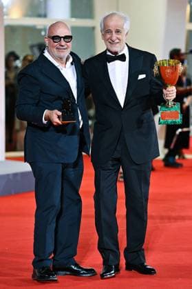 Venice Winners Red Carpet AM Gianfranco Rosi poses with the Special Jury Prize for Below the Clouds and Toni Servillo poses with the Coppa Volpi for Best Actor for La Grazia attending the Winners Red Carpet of the 82nd Venice International Film Festival at the Lido in Venice, Italy on September 06, 2025. Photo by Aurore Marechal ABACAPRESS.COM Venice Italy  Copyright: xMarechalxAurore ABACAx