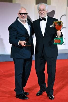 Venice Winners Red Carpet AM Gianfranco Rosi poses with the Special Jury Prize for Below the Clouds and Toni Servillo poses with the Coppa Volpi for Best Actor for La Grazia attending the Winners Red Carpet of the 82nd Venice International Film Festival at the Lido in Venice, Italy on September 06, 2025. Photo by Aurore Marechal ABACAPRESS.COM Venice Italy  Copyright: xMarechalxAurore ABACAx