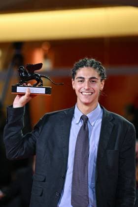 Venice Winners Red Carpet AM Giacomo Covi poses with Orizzonti Best Actor Award for Un Anno di Scuola (A Year of School) attending the Winners Red Carpet of the 82nd Venice International Film Festival at the Lido in Venice, Italy on September 06, 2025. Photo by Aurore Marechal ABACAPRESS.COM Venice Italy  Copyright: xMarechalxAurore ABACAx