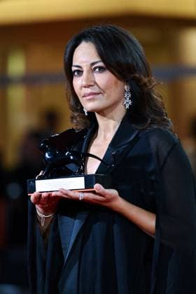 Venice Winners Red Carpet AM Maryam Touzani poses with the Venice Spotlight Armani Beauty Audience Award for Calle Malaga attending the Winners Red Carpet of the 82nd Venice International Film Festival at the Lido in Venice, Italy on September 06, 2025. Photo by Aurore Marechal ABACAPRESS.COM Venice Italy  Copyright: xMarechalxAurore ABACAx
