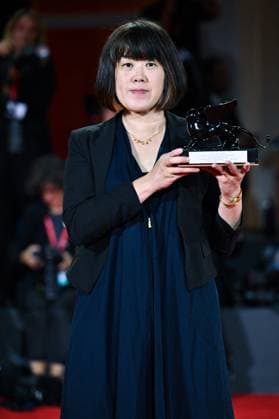 Venice Winners Red Carpet AM Singing Chen poses with the Grand Prize for The Clouds Are Two Thousand Meters Up attending the Winners Red Carpet of the 82nd Venice International Film Festival at the Lido in Venice, Italy on September 06, 2025. Photo by Aurore Marechal ABACAPRESS.COM Venice Italy  Copyright: xMarechalxAurore ABACAx