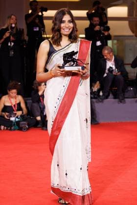 News - 2025 Winners Photocall - The 82nd Venice International Film Festival Anuparna Roy poses with the Orizzonti Best Director Award for Songs of Forgotten Treesduring the winners photocall at the 82nd Venice International Film Festival on September 06, 2025 in Venice, Italy. Photo: Cinzia Camela. Lido di Venezia Palazzo del Cinema Italy Copyright: xCinziaxCamelax xLiveMediax LPN_2013000