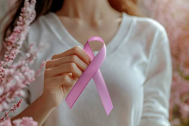 Woman hand gently holding a pink ribbon over her chest to signify breast cancer awareness close up a woman hand with white shirt , holding purple ribbon awareness about breast cancer , cancer awareness concept, --ar 3:2 --quality 2 --stylize 250 --v 6.1 Job ID: ab906b47-fc94-47a3-b557-6735369aece7, 65197892.jpg RECORD DATE NOT STATED AI-GENERATED