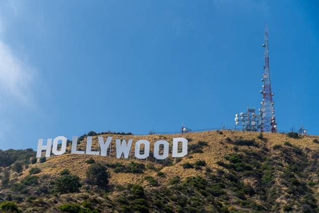 RECORD DATE NOT STATED The iconic Hollywood sign is situated atop a hill, surrounded by lush trees in Los Angeles, California, USA The iconic Hollywood sign is positioned atop a scenic hill that is beautifully surrounded by lush trees, adding to its charm and allure in Los Angeles, California, USA, 95722588.jpg
