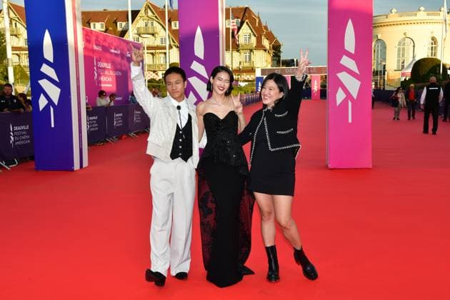 51st Deauville American film festival, jour 3 US film director Jing Ai Ng (R), US actors Brandon Soo Hoo (L) and Andie Ju pose as they arrive for the screening of their movie The Forge during the 51st edition of the Deauville American film festival, in Deauville, northwestern France, on September 8, 2025.  Copyright: xJeanxCharlesx
