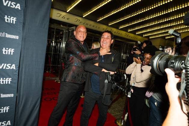 September 8, 2025, Toronto, On, Canada: Mark Coleman pretends to strangle photographer George Pimentel on the red carpet for öÄuThe Smashing MachineöÄÃ¹ at the Toronto International Film Festival in Toronto, Monday, Sept. 8, 2025. Toronto Canada  - ZUMAc35_ 20250908_zaf_c35_170 Copyright: xLauraxProctorx