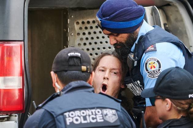 September 10, 2025, Toronto, On, Canada: Toronto Police arrest a man as protesters and counter-protesters gather outside of Roy Thomson Hall during the screening of the documentary The Road Between Us: The Ultimate Rescue at the Toronto International Film Festival in Toronto on Wednesday, Sept. 10, 2025. Toronto Canada  - ZUMAc35_ 20250910_zaf_c35_080 Copyright: xSammyxKoganx