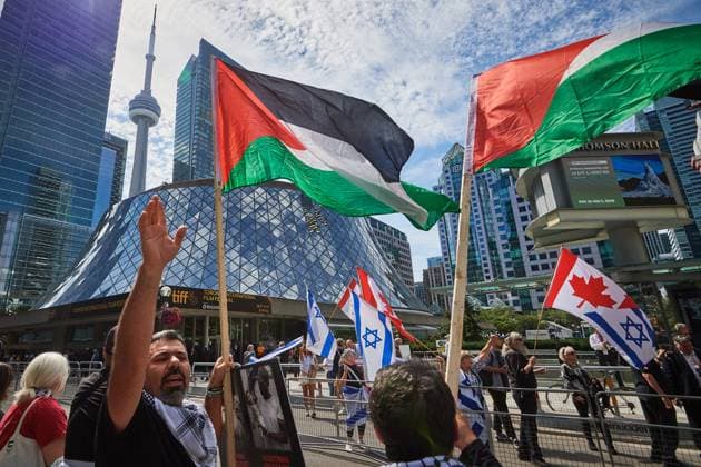 September 10, 2025, Toronto, On, Canada: Protesters and counter-protesters gather outside of Roy Thomson Hall during the screening of the documentary The Road Between Us: The Ultimate Rescue at the Toronto International Film Festival in Toronto on Wednesday, Sept. 10, 2025. Toronto Canada  - ZUMAc35_ 20250910_zaf_c35_060 Copyright: xSammyxKoganx
