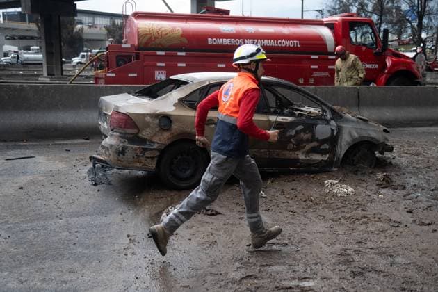 A paramedic attends the explosion scene occurred when a gas tanker overturned, causing the tragic accident that left 70 people have been injured, three dead, and two unidentified at Calzada Ignacio Zaragoza, near the Puente de la Concordia, . on September 10, 2025 in Mexico City, Mexico. Mexico City Mexico - ZUMAe321 20250910_zia_e321_055 Copyright: xMarcoxGonzalezx