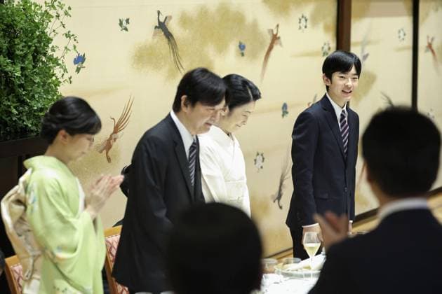 Japan prince s coming-of-age luncheon Japanese Prince Hisahito (far R) speaks at a luncheon celebrating his coming-of-age at the Meiji Kinenkan banquet hall in Tokyo on Sept. 10, 2025, alongside his parents -- Crown Prince Fumihito and Crown Princess Kiko -- and his elder sister Princess Kako (far L). (Pool photo)  A14AA0004839474P