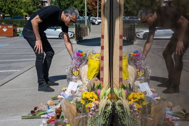September 11, 2025, Richmond Hill, On, Canada: A man places flowers in front of the damaged window the day after an SUV crashed into a daycare in Richmond Hill, Ont., on Thursday, Sept. 11, 2025. Richmond Hill Canada  - ZUMAc35_ 20250911_zaf_c35_041 Copyright: xEduardoxLimax