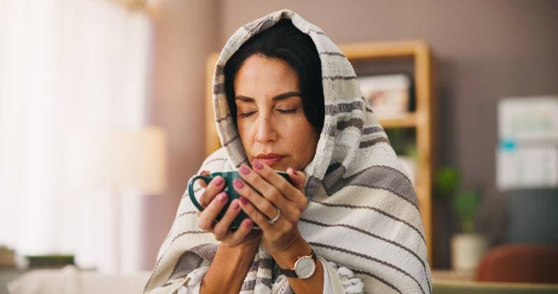 Blanket, sick woman and relax with coffee for virus recovery, cold weather and ginger treatment. Female person, rest and honey tea for illness, herbal drink and health benefits for healing at house Blanket, sick woman and relax with coffee for virus recovery, cold weather and ginger treatment. Female person, rest and honey tea for illness, herbal drink and health benefits for healing at house., model released, , property released, , 97604204.jpg RECORD DATE NOT STATED