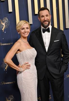(L-R): Sara Wells and Noah Wyle arrive for the 77th annual Primetime Emmy Awards at the Peacock Theater in Los Angeles on Sunday, September 14, 2025.  LAP2025091437 CHISxCHEW