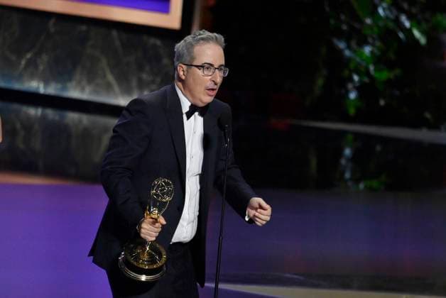 John Oliver (C) accepts the Outstanding Scripted Variety Series award for Last Week Tonight with John Oliver onstage at the 77th annual Primetime Emmy Awards at the Peacock Theater in Los Angeles on Sunday, September 14, 2025.  LAP2025091480485 JIMxRUYMEN
