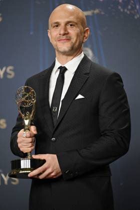 Adam Randall holds the Emmy for Outstanding Directing for a Drama Series for Slow Horses, backstage during the 77th annual Primetime Emmy Awards at the Peacock Theater in Los Angeles on Sunday, September 14, 2025.  LAP20250914193 CHISxCHEW