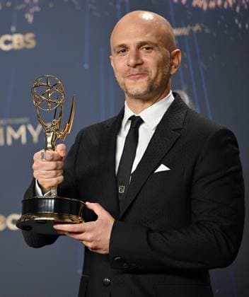 Adam Randall holds the Emmy for Outstanding Directing for a Drama Series for Slow Horses, backstage during the 77th annual Primetime Emmy Awards at the Peacock Theater in Los Angeles on Sunday, September 14, 2025.  LAP20250914201 CHISxCHEW
