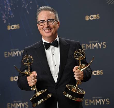 John Oliver holds the Emmy for Outstanding Writing for a Variety Series and Outstanding Scripted Variety Series for Last Week Tonight With John Oliver, backstage during the 77th annual Primetime Emmy Awards at the Peacock Theater in Los Angeles on Sunday, September 14, 2025.  LAP20250914206 CHISxCHEW