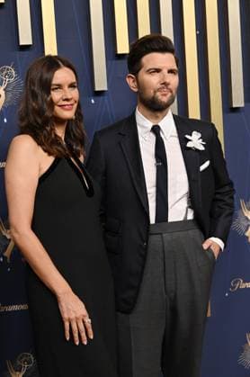 (L-R) Naomi Scott and Adam Scott arrive for the 77th annual Primetime Emmy Awards at the Peacock Theater in Los Angeles on Sunday, September 14, 2025.  LAP20250914227 CHISxCHEW