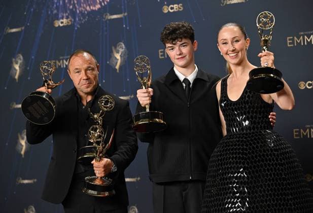 (L-R) Stephen Graha holds the Emmy for Outstanding Limited or Anthology Series, Outstanding Lead Actor in a Limited or Anthology Series or Movie, Outstanding Writing for a Limited Series or Anthology Series or Movie for Adolescence , Owen Cooper holds the Emmy for Outstanding Supporting Actor in a Limited or Anthology Series or Movie for Adolescence, and Erin Doherty holds the Emmy for Outstanding Supporting Actress in a Limited or Anthology Series or Movie award for Adolescence, backstage during the 77th annual Primetime Emmy Awards at the Peacock Theater in Los Angeles on Sunday, September 14, 2025.  LAP20250914294 CHISxCHEW