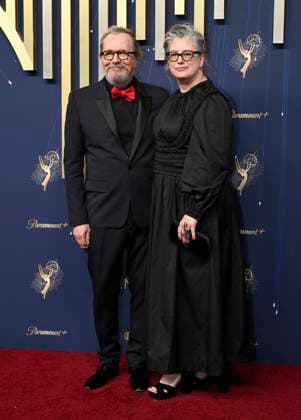 Gary Oldman and his wife Gisele Schmidt arrive for the 77th annual Primetime Emmy Awards at the Peacock Theater in Los Angeles on Sunday, September 14, 2025.  LAP20250914795 JohnxMcCoy