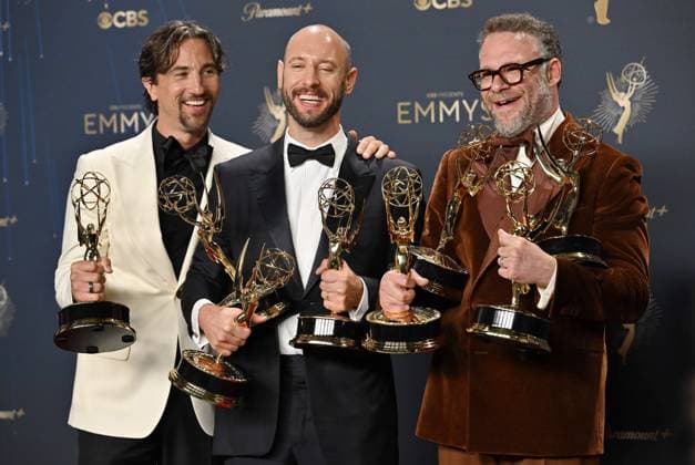 (L-R) James Weaver, Evan Goldberg, and Seth Rogen hold the Emmy for Outstanding Comedy Series, Outstanding Writing For a Comedy Series, Lead Actor in a Comedy Series and more for The Studio, backstage during the 77th annual Primetime Emmy Awards at the Peacock Theater in Los Angeles on Sunday, September 14, 2025.  LAP20250914299 CHISxCHEW