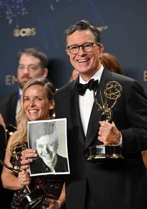 Stephen Colbert holds the Emmy for Outstanding Talk Series award for The Late Show with Stephen Colbert, backstage during the 77th annual Primetime Emmy Awards at the Peacock Theater in Los Angeles on Sunday, September 14, 2025.  LAP20250914301 CHISxCHEW