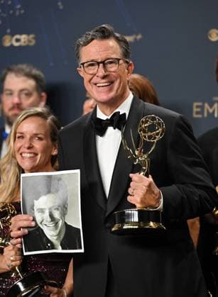 Stephen Colbert holds the Emmy for Outstanding Talk Series award for The Late Show with Stephen Colbert, backstage during the 77th annual Primetime Emmy Awards at the Peacock Theater in Los Angeles on Sunday, September 14, 2025.  LAP20250914302 CHISxCHEW