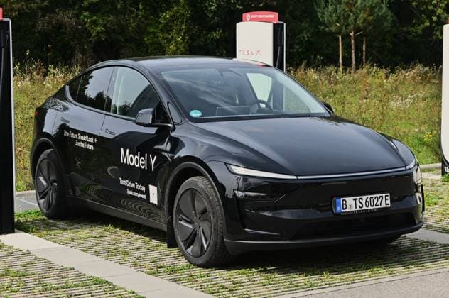 Motorworld Mobility Days is a cooperation partner of the IAA Mobility 2025 Several days of events and exhibitions took place during the International Motor Show in Munich Freimann Photo Tesla Model Y in front of an electric charger or an electric charging station