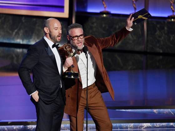 Evan Goldberg (L) and Seth Rogen accept the Outstanding Directing For a Comedy Series award for The Studio onstage at the 77th annual Primetime Emmy Awards at the Peacock Theater in Los Angeles on Sunday, September 14, 2025.  LAP20250914914 JIMxRUYMEN