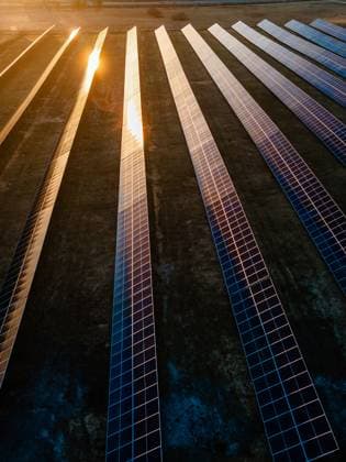 Aerial view of industrial sized solar panel farm during sunset, illustrating the blend of technology and nature Aerial view of industrial sized solar panel farm during sunset, illustrating the blend of technology and nature, 64453348.jpg RECORD DATE NOT STATED