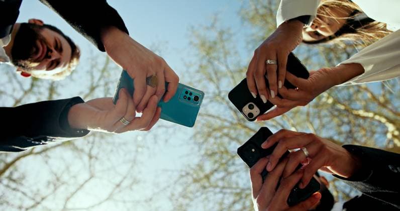 Business people, hands and phone in circle outdoor for global connection, team chat and b2b networking. Low angle, employees and smartphone at park for data sharing, online news and corporate website Business people, hands and phone in circle outdoor for global connection, team chat and b2b networking. Low angle, employees and smartphone at park for data sharing, online news and corporate website., model released, , 95610390.jpg RECORD DATE NOT STATED