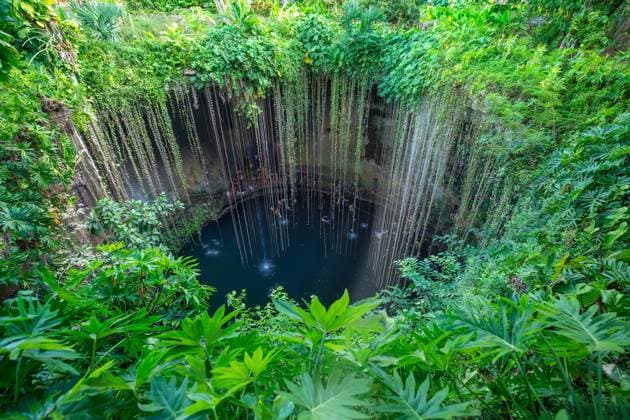 Mexico, Ik Kil Cenote near Merida Yucatan Peninsula in Archeological Park near Chichen Itza Mexico, Ik Kil Cenote near Merida Yucatan Peninsula in Archeological Park near Chichen Itza. Model Released GentleGiantProductions_ID27309_783946_004 Copyright: xx RECORD DATE NOT STATED
