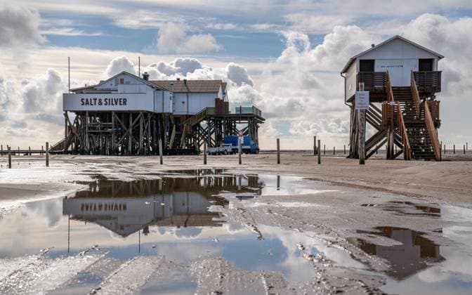 RECORD DATE NOT STATED Sankt Peter Ording, North Frisia, Germany SANKT PETER ORDING, GERMANY - MARCH 8, 2023: Panoramic image of beach houses of Sankt Peter Ording close to the North Sea on March 8, 2023 in North Frisia, Germany, 95869406.jpg
