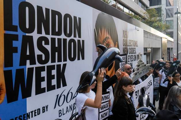 . 19 09 2025. London, United Kingdom. Low Wages Protest London Fashion Week. Billionaires out of fashion protest against low wages for workers outsside London Fasion Week venue at 180nthe Strand.  xMartynxWheatleyx xi-Imagesx IIM-26244-0010
