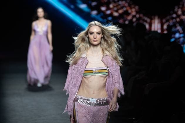 Custo Barcelona fashion show at MBFW Madrid A model during the Custo Barcelona fashion show at the 82nd edition of Mercedes Benz Fashion Week Madrid, at Ifema in Madrid, on September 19, 2025, in Madrid Spain This years edition is held from September 17 to 21 and commemorates the 40th anniversary of the catwalk Isabel Sanchíss collection for next summer 2026 is an eclectic collection, based on two fundamental pillars for the firm, the volumes of the architecture and the coexistence of Japanese culture, which explores the opposite values such as tradition and modernity, structure and fluidity, discipline and challenge and the past and future Spain.  Copyright: xRicardoxRubiox 6967620