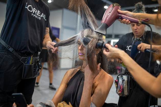 September 20, 2025, Madrid, Madrid, Spain: Stylists style a model s hair before Fely Campo Spring Summer 2026 collection runway show during the 40th Mercedes-Benz Fashion Week in Madrid. Madrid Spain - ZUMAs296 20250920_znp_s296_003 Copyright: xLuisxSotox
