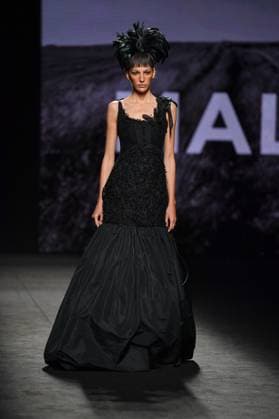 Mercedes-Benz Fashion Week de Madrid - 20 Sep 2025 A model walks the runway wearing a design by MALNE during the Mercedes-Benz Fashion Week de Madrid in IFERMA. Madrid Spain Copyright: xAtilanoxGarciax xSOPAxImagesx FOTO48627