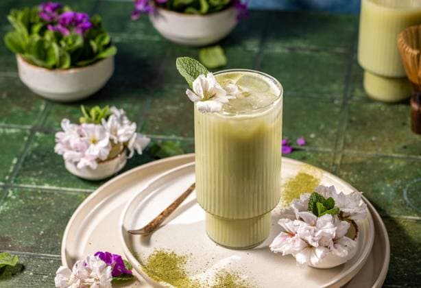 Iced matcha latte garnished with fresh mint and cherry blossoms Refreshing iced matcha latte decorated with fresh mint and delicate cherry blossoms, served on a stylish plate with matcha powder, 94709066.jpg RECORD DATE NOT STATED
