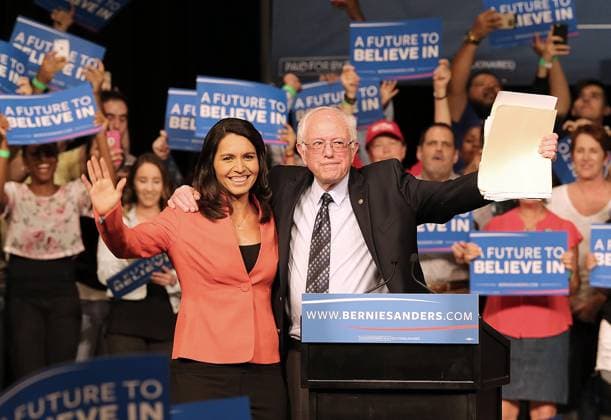 Sanders Pulls Off Upset Win In Michigan Primary March 8, 2016 - Miami, FL, USA - Rep. Tulsi Gabbard, D-Hawaii, and Democratic presidential candidate Sen. Bernie Sanders wave to supporters during a campaign event in Miami at the James L. Knight Center on Tuesday, March 8, 2016. Copyright: xPedroxPortalx