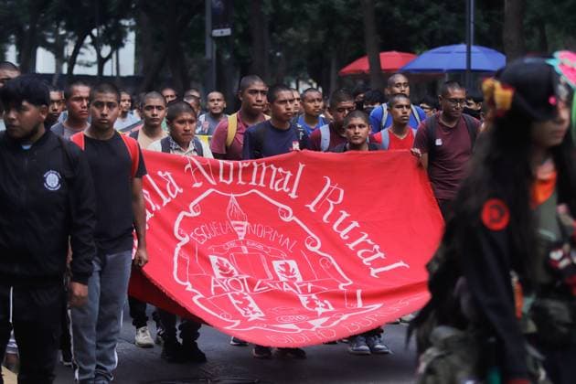 Rural students from Ayotzinapa Teacher Training School take part in a demonstration during the Ã¢â‚¬oeAyotzinapa 11 Years of Light and ShadowsÃ¢â‚¬Â day of action, demanding that the Ministry of Foreign Affairs help secure the extradition of Tomas Zeron, former head of the Criminal Investigation Agency, who is currently a fugitive in Israel. on September 24, 2025 in Mexico City, Mexico. Mexico City Mexico - ZUMAe321 20250924_zia_e321_018 Copyright: xCarlosxSantiagox