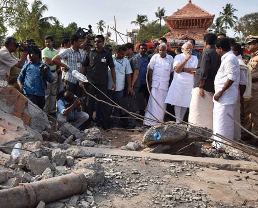 Indian Prime Minister Modi Visits Temple Disaster in Kerala April 10, 2016 - Kollam, Kerala, India - Indian Prime Minister Narendra Modi along with the Chief Minister of Kerala, Oommen Chandy view the destruction at the Puttingal Temple Paravur April 10, 2016 in Kollam, Kerala, India. At least 100 people were killed and 500 injured after a fireworks display exploded during a Hindu New Year festival. Copyright: xPressxInformationxBureaux