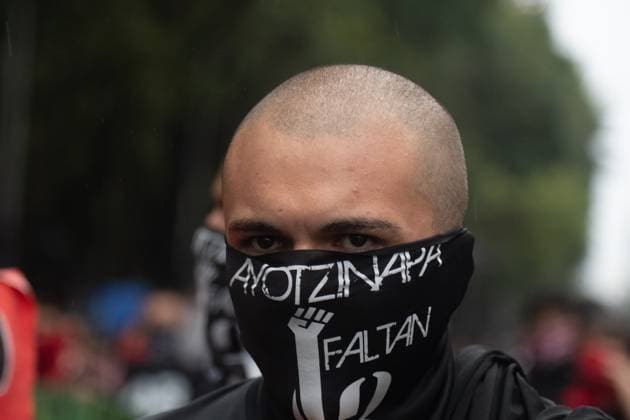 11th Anniversary of the 43 Ayotzinapa students Missing A man taking part during a rally in memory of the 43 missing students from the Ayotzinapa Teacher Training School, to demand justice for the crime . on September 26, 2025 in Mexico City, Mexico. (Photo by Carlos Santiago Eyepix Group) Copyright: xMarcoxGonzalez xEyepixxGroupx MTG_26092025_170858JPEG