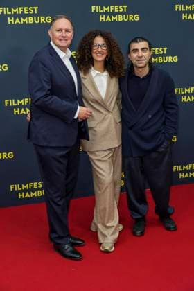 abb Carsten Brosda, Malika Rabahallah, Fatih Akin as guests on the Red Carpet at the Kino Film Premiere Amrum at Filmfest Hamburg at Cinemaxx Kino am Dammtor on September 27, 2025 in Hamburg Hamburg Germany