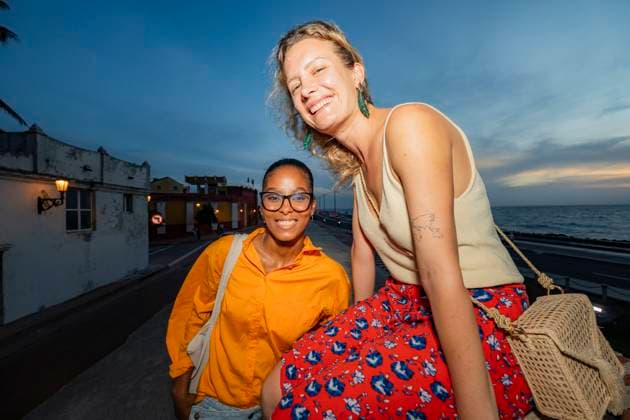 Smiling friends enjoying a sunset in Cartagena Young multiethnic women friends, one Caucasian and one Black, are smiling and enjoying a sunset in Cartagena de Indias, capturing the vibrant spirit of friendship. Model Released VictorCuenca_ID31212_1059453_028 Copyright: xVictorxCuencax RECORD DATE NOT STATED