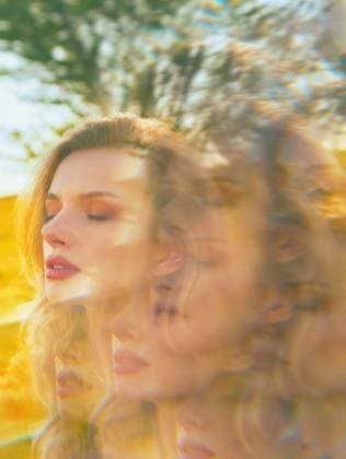 Ethereal image of woman with prismatic photography effect Ethereal image of a woman with eyes closed in a summer meadow, captured with a prismatic photography effect creating a dreamy, multi-exposure kaleidoscope look. Her serene expression evokes tranquility. Model Released Zhenikeyev_ID31224_1059776_019 Copyright: xZhenikeyevx