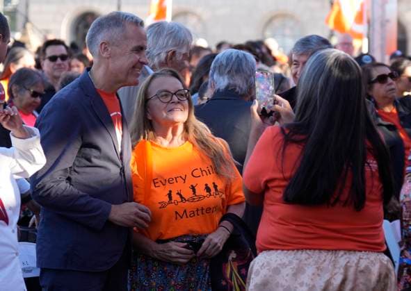 September 30, 2025, Ottawa, On, Canada: Prime Minister Mark Carney takes a photo with a woman following ceremonies for the National Day for Truth and Reconciliation on Parliament Hill in Ottawa, Tuesday, Sept. 30, 2025. Ottawa Canada  - ZUMAc35_ 20250930_zaf_c35_094 Copyright: xAdrianxWyldx