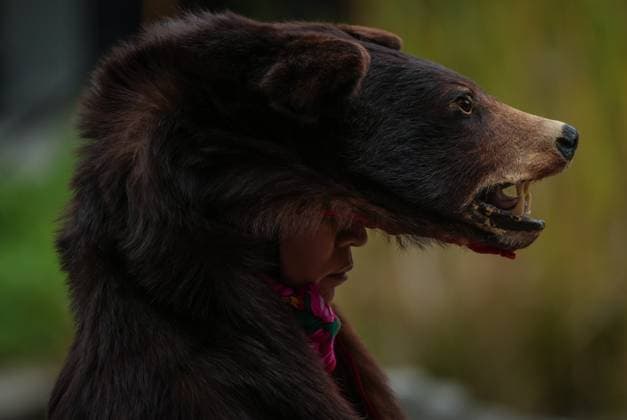 September 30, 2025, Vancouver, Bc, CANADA: Aileen Michel (L il Bear) wears a bear hyde as she listens before performing a bear dance during a gathering to mark the National Day for Truth and Reconciliation, in Vancouver, on Tuesday, September 30, 2025. Vancouver CANADA  - ZUMAc35_ 20250930_zaf_c35_108 Copyright: xDarrylxDyckx