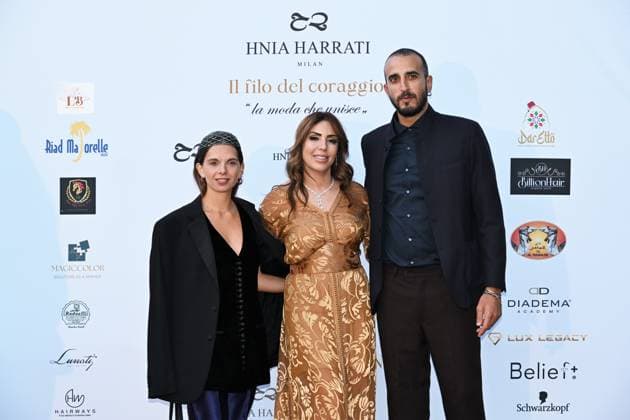 Milan, Italy Il Filo del Coraggio fashion show event dedicated to women against violence by the Italian-Moroccan designer Hnia Harrati at the Fontana e Rocce of Palazzo Lombardia during Fashion Week attended by personalities, institutions and associations. In the photo: Hnia Harrati with personalities from the consulates.  Copyright: xNickxZonnax xipa-agency.netx xNickxZonnax IPA_Agency_IPA66058172