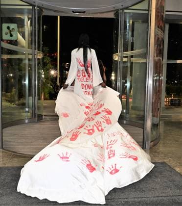 Milan, Italy Il Filo del Coraggio fashion show event dedicated to women against violence by the Italian-Moroccan designer Hnia Harrati at the Fontana e Rocce of Palazzo Lombardia during Fashion Week. Celebrities, institutions and associations are present. In the photo: model at the closing show with a particular white dress symbolizing the fight against violence against women.  Copyright: xNickxZonnax xipa-agency.netx xNickxZonnax IPA_Agency_IPA66058226
